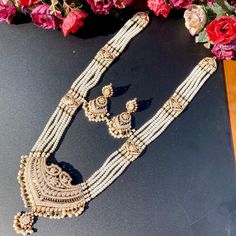 Featuring an all pearl long necklace set made in 22k gold. Ideal for wearing on special occasions, this timeless set is sure to be a treasured heirloom for generations to come. The necklace weighs 94.57 gms including 3.74 gms in the hanging pearls, 38.75 gms in the stringing pearls. The earrings weigh 17.66 gms including 1.93 gms in the hanging pearls. This timeless piece features a graceful design and exquisite craftsmanship, making it an ideal addition to your accessories collection. Watch Pro Gold Temple Necklace With Pearl Pendant, Ceremonial Gold Pearl Necklace With Tilla Detailing, Traditional Gold Temple Necklace With Pearls, Ceremonial Gold Pearl Necklace With Tilla, Traditional Pearl Temple Necklace In Gold, Traditional Gold Pearl Drop Necklace, Traditional Gold Pearl Temple Necklace, Traditional Kundan Pearl Necklace In Yellow Gold, White Pearl Necklace In 22k Gold Temple Jewelry Style