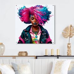 a painting of a woman with pink and blue hair on a wall above a couch