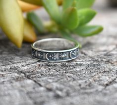 "Moon, Sun, & Star Band: -Solid .925 sterling silver -Measures 5mm wide -Comfortable and easily stackable! -Available in US sizes 4-10.5 with half sizes. More rings here: https://www.etsy.com/shop/AWildViolet?ref=seller-platform-mcnav&section_id=13958646 Looking for a last minute or unique Christmas gift? Visit our \"READY TO SHIP\" section here, ships out in one business day https://www.etsy.com/shop/AWildViolet?section_id=23587515 Connect with us on Instagram @a_wild_violet for sales and givea Celestial Style Adjustable Stackable Rings For Anniversary, Nickel-free Celestial Moon Ring, Adjustable Crescent Moon Phase Ring, Adjustable Sun And Moon Design Promise Rings, Celestial Stamped 925 Promise Ring, Celestial Style Promise Ring Stamped 925, Celestial Stackable Promise Rings, Celestial Adjustable Midi Rings, Sterling Silver Celestial Jewelry Stamped 925