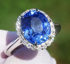 A Breathtakingly Striking  HANDMADE 14k White Gold Ring with Beautiful Oval cut Sapphire in Blue color! The GEM is 5.87 CT and measures 11.07x9.24x6.82 mm! This Stone will take your breath away, especially on the sunlight! You will want to look at this stone endlessly. The mounting is a masterpiece! HANDMADE 14K White Gold Mounting (tested), that was is custom made to Accommodate this Beauty of a Gem in Prongs setting! Super FINE Workmanship on the Diamond prong  setting with 22 pcs Brilliant Full Cut Diamonds in GH color, SI1 clarity, totaling to approx 0.38 ct ! Fabulous Braided Band and Diamond Gallery! The Entire Top's outline is 13.7x12.3 mm- HUGE. The Ring weights 5.3 g, nice and SOLID. Sits 8.2 mm off the top of the finger. Finger size 7 (Free Re-sizing with purchase). Center Stone: Exquisite Oval Brilliant-cut Gemstones, Exquisite Oval Brilliant Cut Gemstones, Gia Certified Oval Sapphire Diamond Ring, Oval Sapphire Ring Gia Certified, Gia Certified Oval Sapphire Ring In Platinum, Luxury Oval Diamond Cut Gemstones, Blue Oval Sapphire Ring With Vvs Clarity, Oval Blue Sapphire Ring With Vvs Clarity, Oval Diamond-cut Gemstones For Formal Occasions