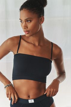 Every wardrobe needs one (or 10). Offered in a rainbow of colors, the Reegan is a soft, stretchy, short-and-sweet tube top complete with casual ribbing. | The Reegan Seamless Ribbed Cropped Tube Top by Anthropologie in Black, Women's, Size: XS/s, Nylon/Elastane/Tin Black Seamless Crop Top For Layering, Stretch Seamless Crop Top For Loungewear, Seamless Stretch Crop Top For Loungewear, Compressive Seamless Crop Top For Spring, Casual Ribbed Tops In Seamless Fabric, Fitted Bandeau Top For Workout, Stretch Bandeau Workout Tops, Seamless Ribbed Workout Tops, Cropped Nylon Stretch Tops