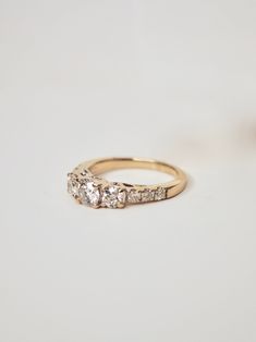 an engagement ring with three diamonds on it