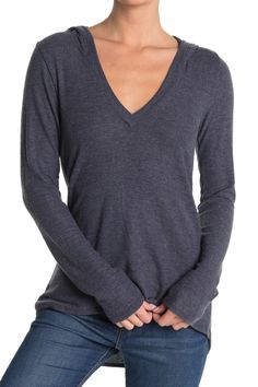 Perfect your casual style with a top cut from comfy knit fabric. Attached hood. V-neck. Long sleeves. Slips on over head. Knit construction. Approx. 27" length. Imported Soft-washed Tops For Winter Layering, Fall Long Sleeve V-neck Top, Casual Stretch V-neck Top With Long Sleeves, Casual Long Sleeve Stretch V-neck Top, Casual Stretch V-neck Sweater, Fall V-neck Loungewear Tops, Casual V-neck Long Sleeve Top For Loungewear, Casual Long Sleeve V-neck Top For Loungewear, Casual V-neck Top For Fall Loungewear