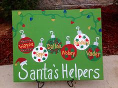 a sign that says santa's helpers on it