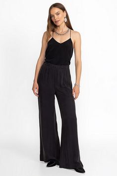 Crafted from a lightweight flowing fabric, the Corianne Easy Pants are a wardrobe essential. Featuring an elastic waist and pockets at the seam, these relaxed fit trousers are finished with a flowing flared leg. Pair with a classic tee or tank and flat leather slides for an easy polished daily look. Johnny Was Women's Corianne Easy Pant in Black, Size Large, Leather Viscose Bottoms With Elastic Waistband And Tapered Leg, Black Viscose Pants For Summer, Elegant Tapered Leg Viscose Bottoms, Elegant Viscose Tapered Leg Bottoms, Viscose Pants With Elastic Waistband, Summer Viscose Bottoms With Tapered Leg, Summer Viscose Tapered Leg Bottoms, Chic Rayon Bottoms With Elastic Waistband, Chic Tapered Leg Pants With Elastic Waistband