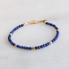 Gorgeous natural lapis is hand strung to create this beaded bracelet.  It's accented with 14kt gold filled touches.  Lapis is know as the friendship stone! D E T A I L S *Hand strung genuine natural lapis *14kt gold filled accent beads  *Fits up to a 6.5 inch wrist, optional extender available ∙ EXTRA LOVE ∙ Handcrafted just for you in sunny Arizona by a team of talented women. All of our jewelry comes gift packaged! We are happy to leave a note if this is a special gift, just let us know in the message box at checkout. PRODUCTION ∙ TIMES All items are made to order. Please check the estimated delivery in the shipping section for the most current production time. If you need it sooner, select a faster shipping at checkout. All designs & content © The Silver Wren Adjustable Lapis Lazuli Beaded Bracelets Bohemian Style, Lapis Lazuli Gemstone Beads Bracelets As Gift, Adjustable Lapis Lazuli Bracelet With Round Beads, Lapis Lazuli Beaded Bracelets For Healing, Lapis Lazuli Beaded Bracelet Gift, Lapis Lazuli Gemstone Beads Bracelet For Gift, Lapis Lazuli Gemstone Beaded Bracelet For Gifts, Elegant Adjustable Lapis Lazuli Beaded Bracelet, Healing Lapis Lazuli Beaded Bracelets