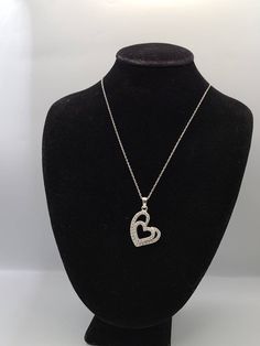 925 Silver Cubic Zirconia Double Heart Pendant Necklace Item w#2408 Clean and in good condition  18 inch chain with a spring ring clasp  1 inch pendant Marked 925 Welcome to Westgate Jewels!! We specialize in vintage estate, designer, and fine jewelry. Our shop consists of items that are estate, antique, and / or vintage conditions unless otherwise noted. This means that most items are prior owned and may have some imperfections such as light scratches, scuffs, and / or patina. Our items are cle Silver Diamond Pendant Necklace For Valentine's Day, Silver Heart-shaped Cubic Zirconia Diamond Necklace, Silver Necklaces With Heart Charm In Cubic Zirconia, Silver Necklace With Heart Charm In Cubic Zirconia, Silver Necklace With Cubic Zirconia Heart Charm, Silver Necklaces With Cubic Zirconia Heart Charm, Silver Heart Necklace With Sparkling Stones, Formal Silver Heart-shaped Diamond Necklace, Silver Heart Pendant Necklace With Sparkling Stones