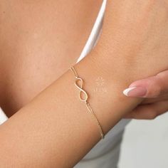 ABOUT PRODUCT  This 14K Gold Infinity Bracelet is suitable gift for girlfriend, mom and her. You can even buy as a birthday gift for your friends or anniversary gifts, If you want to add a special note we can write for you and put to inside of package. We manufacture our jewelry pieces with carefully and after production we double checking in quality control department. Our main idea is keep our items for daily wearing especially for minimalist jewelry pieces. 14K Gold Infinity Bracelet, Eternit Minimalist Infinity Bracelet With Adjustable Chain, Minimalist Infinity Bracelets For Anniversary, Minimalist Infinity Bracelet For Anniversary, Elegant Infinity Bracelets For Mother's Day, Elegant Infinity Bracelet For Mother's Day, Minimalist Infinity Bracelet As A Gift, Minimalist Infinity Bracelets For Gifts, Minimalist Infinity Bracelets As Gift, Minimalist Infinity Bracelet For Gift