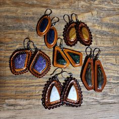 Hand picked matching stones inlayed in English tanned leather with a wax finish - stainless steel hooks and bails -English (rust color) tanned -Wax finish coat -Double leather totaling 6oz thickness $Find more of my rustic hand made designs https://www.etsy.com/shop/KCsDesignsShop #Message for coupons and sale codes if you can't find them on-site. Adjustable Vintage Brown Leather Jewelry, Artisan Brown Earrings With Natural Stones, Rust Teardrop Handmade Jewelry, Brown Adjustable Earrings With Natural Stones, Bohemian Hand-tooled Leather Earrings, Brown Natural Stone Drop Earrings, Unique Brown Jewelry For Everyday Use, Artisan Brown Earrings For Gift, Vintage Brown Hand-tooled Jewelry