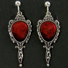 Dark blood red and antique silver clip on earrings feature an ornate mirror shape with red resin inlay. Style brings to mind vampire movies or old fairy tales. Earrings are 1 3/4 inches (45mm) long with screw backs and comfort cushions. See all photos for size reference. Matching necklace - https://www.etsy.com/listing/1069303835/dark-blood-red-antique-silver-necklace?ref=listing_published_alert Thank you for stopping by! Find more clip on styles here - https://www.etsy.com/shop/CharleneSevier?r Vampire Fairy, Vampire Jewelry, Resin Inlay, Antique Silver Necklace, Vampire Movies, Menu Sign, Ornate Mirror, Gothic Victorian, Dark Blood