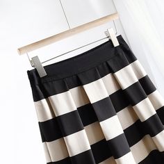 Discover Sophistication and Style Step into the season with confidence and grace with our Elegant Striped Mid-Calf Pleated Skirt. Perfectly tailored for the discerning woman who dresses to impress, this skirt combines classic stripes with a modern silhouette to elevate your wardrobe essentials. Crafted from high-quality polyester and designed with a blend of style and comfort, it's your ideal companion for both office and leisure. Product Features Material: Premium polyester for durability and easy care. Style: Office Lady, perfect for professional environments or sophisticated social settings. Elasticity: Slight stretch to accommodate your body shape comfortably. Season: Ideal for Spring/Summer, designed to keep you cool and stylish. Fabric Type: Blended fabric that offers breathability a Cardigan Sweater Vest, Crop Top Shirts, Mens Shoes Boots, Office Lady, Mens Slippers, Ladies Tops Fashion, Office Ladies, Fashion Tops, Stripes Design