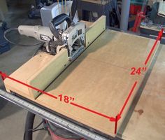 a table sawing machine on top of a piece of cardboard with measurements for the width