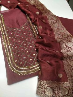 Item Overview ATHARVA Hand Embroidery Salwar Kameez w/Embroidery Neck Maroon/Banarsi Silk Dupatta/Gota Patti/ Custom Stitch/Anarkali/Patiala/ Dno. CH1552B Fabric: * Shirt- Chanderi Silk - Embroidered Neck- Maroon - 2.5 Mts Beautiful Hand Embroidery * Dupatta: Banarsi Silk Dupatta- Zari Meenakari Dupatta- 2.5 Mts- Latkans Tassels- (Motifs may wary) * Bottom Santoon Silk 2.5 Mts. Excusive Hand Embroidered Party Wear Punjabi Suit. Customization: * Fabrics Customization: Designs Can be made in diffe Semi-stitched Anarkali Kurta With Zari Work, Diwali Anarkali Traditional Wear With Zari Work, Festive Salwar Kameez With Gota Work, Anarkali Semi-stitched Kurta With Zari Work, Anarkali Salwar Kameez With Zari Work For Diwali, Unstitched Anarkali Churidar For Festive Occasions, Semi-stitched Cutdana Raw Silk Kurta, Navratri Raw Silk Churidar With Cutdana, Transitional Semi-stitched Kurta With Gota Work