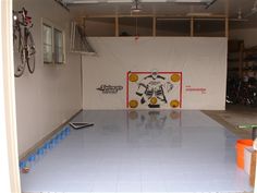 the garage is clean and ready to be used as a storage area for bicycles or other things