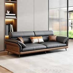 a couch sitting in front of a book shelf filled with books