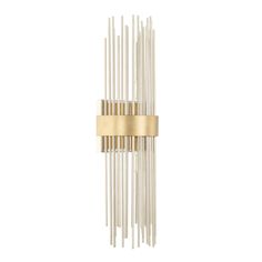 a wall light that is made out of metal rods and gold colored wood sticks with a white background