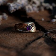 Illyrian Inspired Wings Ring is a reminder of magical tales, this classic ring has been carefully crafted for timeless beauty. Representing the beauty and grace of Illyrian wings, it’s an elegant piece sure to bring a touch of enchantment to any outfit fans of the ACOTAR series or not! Handmade in Sterling silver, brass. Sterling silver ring brass wings 6mm Amethyst inspired by Rhys's eyes 6mm Ruby inspired by Cassian's Siphons 6mm Sapphire inspired by Azriel's Siphons MADE TO ORDER. Available to ship in 5-7 business days. Spiritual Open Ring Jewelry For Formal Occasions, Mystical Rings With Accent Stones For Anniversary, Mystical Yellow Gold Jewelry For Anniversary, Mystical Anniversary Rings With Accent Stones, Mystical Gemstone Jewelry For Formal Occasions, Mystic Anniversary Ring With Accent Stones, Nature-inspired Polished Finish Ring, Mystical Gemstone Rings For Formal Occasions, Spiritual Formal Rings With Accent Stones