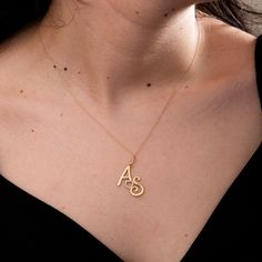 Symbol of Togetherness: Two Initials Necklace in 14K 18K Gold Embrace the bond of love with our Two Initials Necklace, a couple's pendant produced in 14K or 18K real gold. This personalized masterpiece features two letters, creating a symbolic representation of your connection. Perfect as an anniversary gift or a Christmas surprise, the delicate design and tilted two initials add a touch of elegance to this dainty love necklace. Celebrate your unique connection! Order the Two Initials Necklace n 14k Gold Initial Pendant Name Necklace For Anniversary, 14k Gold Initials Name Necklace For Anniversary, 14k Gold Anniversary Name Necklace With Initial Pendant, Gold Plated Initials Name Necklace For Anniversary, Valentine's Day 14k Gold Name Necklace With Hallmark, 14k Yellow Gold Initial Necklace For Mother's Day, 14k Yellow Gold Name Necklace With Hallmark, Yellow Gold Pendant Name Necklace For Anniversary, Gold Plated Initial Pendant Necklace For Anniversary