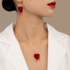 Blood drop red resin heart dripping with 2 droplets of ruby blood Material: Custom handcut resin heart Gold chain with an arrow toggle clasp in front Heart Dripping, Sunglasses Necklace, Blood Drop, Heart Red, Red Blood, An Arrow, Jewelry Accessories Ideas, Ring Bag, Necklace Heart