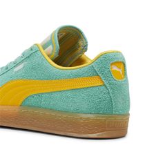 The Suede Hit The Scene In 1968 And Has Been Changing The Game Ever Since. It's Been Worn By Icons Of Every Generation, And It's Stayed Classic Through It All. Instantly Recognisable And Constantly Reinvented, Suede's Legacy Continues To Grow And Be Legitimised By The Authentic And Expressive Individuals That Embrace The Iconic Shoe. This Supertifo Version Features A Hairy Suede Upper, Speckled Laces, And A Bold Tongue Design. Features & Benefits Puma's Leather Products Support Responsible Manufacturing Via The Leather Working Group: Www. leatherworkinggroup. com Details Regular Fithairy Suede Upperhairy Suede Overlaystextile Liningspeckled Laces, With Hairy Suede Lace Looprubber Midsole And Outsolesynthetic Puma Formstrip And Fottextile Tongue With Striped Design And Puma Cat Embroiderypu Vintage Yellow Sneakers For Streetwear, Retro Green Sneakers With Cushioned Footbed, Vintage Green Sneakers With Round Toe, Retro Green High-top Skate Shoes, Vintage Green Sneakers With Vulcanized Sole, Vintage Green Low-top Sneakers, Retro Green Skate Shoes With Vulcanized Sole, Retro Green Skate Shoes For Streetwear, Vintage Yellow Sneakers For Sports