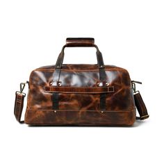 Here is the perfect blend of sophistication and style with our unique leather duffle bag in a rich, textured saddle tan, accented by sleek black handles. The full-grain buffalo leather adds to the endurance yes well as the charm of the duffle bag. Best for short trips and routine journeys. Elevate your travel game with this distinctive accessory today! Salient Features Made of full-grain premium buffalo leather Pure brass hardware with bottom studs to protect the bag Adjustable leather shoulder Travel Satchel With Leather Handles And Oiled Leather, Rugged Leather-backed Satchel For Everyday, Rugged Leather Satchel For Everyday Use, Brown Leather Trim Tote Travel Bag, Rugged Brown Bag With Luggage Sleeve, Brown Tote Travel Bag With Leather Trim, Brown Oiled Leather Duffle Bag For Travel, Brown Oiled Leather Satchel For Travel, Classic Brown Travel Bag With Leather Trim