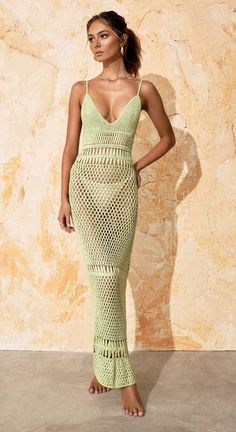 Embrace the sun in Flook the Label's unique Luana Dress. Featuring a sheer, curve-huging silhouette and low-dipped back, this floor-length garment is complete with intricately crocheted motifs. Available in the shade of Lime or Off-White. Fitted Maxi Dress For Beach Season, Fitted V-neck Maxi Dress For Beach, Elegant Bodycon Maxi Dress For Beach, Elegant Bodycon Beach Maxi Dress, V-neck Bodycon Maxi Dress For Beach, Fitted Maxi-length Backless Dress For Vacation, Beachwear Maxi Dress With Hollow Out Design, Beachwear Hollow Out Maxi Dress, Hollow Out Maxi Beachwear Dress