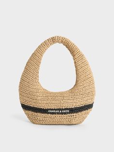 There is nothing like a woven bag to get you in the mood for summer, and this Allegra hobo bag makes for the perfect companion for days spent under the sun. Featuring a slouchy construction and a curved silhouette, it is made with an of-the-moment knitted material. Tthese design elements come together to create a bag that will make you stand out this season. This neutral beige bag is enlivened by a contrasting black line that runs across its body. Luxury Beige Hobo Bag With Intrecciato Weave, Summer Rectangular Bucket Bag With Intrecciato Weave, Chic Woven Beach Bag With Round Handle, Chic Beach Shoulder Bag With Round Handle, Chic Shoulder Bag With Round Handle For Beach, Summer Bucket Bag With Intrecciato Weave, Chic Woven Leather Bucket Bag For Beach, Beige Bucket Bag With Intrecciato Weave For Vacation, Chic Everyday Bucket Bag With Open Weave