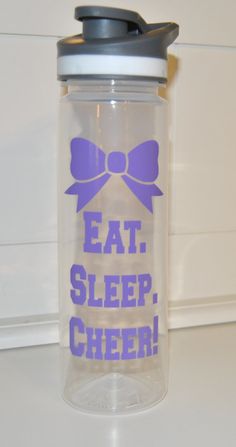 a plastic cup with a lid that says eat sleep cheer