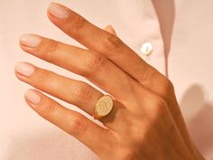 Solid gold Oval Signet Ring from your choice of yellow gold, white gold or rose gold, with 4 different size options. Customize this signet ring with your name, initials, or monogram. This classic signet ring is perfect for everyday wear and can be used as a family crest, coat of arms ring, graduation ring, personalized gift, or any other deserved reward. FeaturesGold Kt Options: 14k (18k is also available with 1-2 days of more production time)Color Options: Yellow Gold, Rose Gold and White GoldA Graduation Ring, Oval Signet Ring, Graduation Rings, Engraved Initials, Name Initials, Meaningful Messages, Pinky Ring, Family Crest, Signet Ring