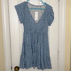 Urban Outfitters, Size Xs, Never Worn, Tags Still On Casual V-neck Fitted Sundress, Blue V-neck Sundress For Spring, Blue Ditsy Floral Print Knee-length Dress, Blue V-neck Sundress Mini Dress, Urban Outfitters V-neck Sundress For Summer, Light Blue Mini Sundress Casual Style, Light Blue Casual Mini Sundress, Casual Light Blue Mini Sundress, Blue Short Sleeve Sundress For The Beach