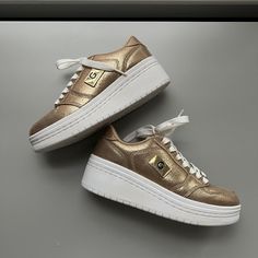 G By Guess Sneakers. Gold Color. Brand New. Soft And Comfortable. Gold Low-top Sporty Platform Sneakers, Gold Low-top Platform Sneakers, Sporty Platform Sneakers With Metallic Logo, Low-top Platform Sneakers With Metallic Logo, Casual Gold Sneakers With Metallic Logo, Gold Casual Sneakers With Metallic Logo, Casual Gold Low-top Platform Sneakers, Sporty Gold Platform Sneakers With Round Toe, Gold Wedge Sneakers With Round Toe