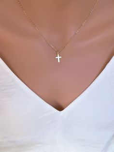 Dainty 14k Gold fill Cross Necklace Woman. Super cute small cross necklace is great gift for her Christmas, This necklace is made of.... -14k gold fill 15mm cross pendent, and -14k gold fill cable chain with spring clasp, -Come up with beautiful ribbon gift box and -One set of Care instruction package. MORE CROSS JEWELRY https://www.etsy.com/shop/rainbowearring?search_query=CROSS MORE LAYERED NECKLACES https://www.etsy.com/shop/rainbowearring1?section_id=17891444&ref=shopsection_leftnav_5 CO Minimalist Cross Pendant Charm Necklace, Minimalist Crucifix Jewelry With Delicate Chain, Simple Yellow Gold Cross Necklace, Dainty 14k Gold Cross Necklace With Delicate Chain, Minimalist 14k Gold Cross Necklace With Delicate Chain, Minimalist Yellow Gold Cross Necklace, Simple Cross Jewelry With Delicate Chain, Dainty 14k Gold Cross Pendant Charm Necklace, Dainty 14k Gold Cross Charm Necklace