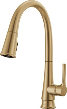 a kitchen faucet with the pull out sprayer in brushed brass finish, on an isolated white background