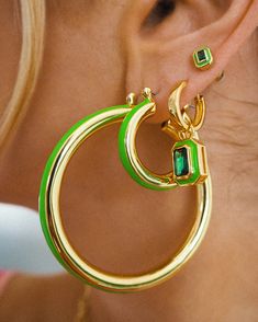 Pair of large metal tube hoops with a bright green enamel stripe Sold as a pair for pierced ears 50mm x 5mm Each hoop weighs 12 grams Made from Brass Plated Gold Posts are made from surgical steel so they are very hypo-allergenic for sensitive ears Earrings are 100% nickel-free and cadmium-free 1 year warranty Packaged in Luv Aj branded gift boxes Single Green Hoop Earring, Green Hoop Earrings Gift, Green Hoop Earrings For Gift, Green Pierced Hoop Earrings, Green Enamel Single Earring, Small Green Pierced Hoop Earrings, Modern Enamel Hoop Earrings, Single Green Enamel Earring, Trendy Small Hoop Earrings In Green