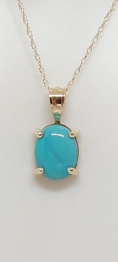 TURQUOISE Pendant / Necklace /Charm in 14k Yellow Gold 18 Inches Rope Chain. 14k Yellow Gold Oval Turquoise Pendant. Real Turquoise Stone. Product Info: -Stone: Natural Turquoise. -Metal: 14k Yellow Gold. -Pendant Measures: 13 x 5mm. -Turquoise Measures: 7x5mm -Chain length: 18 Rope Inches. -Made in USA. -Nice Gift Box Included. Fine Jewelry Turquoise Oval Necklaces, Oval Turquoise Necklace In Yellow Gold As Gift, Fine Jewelry Oval Turquoise Necklace, Yellow Gold Oval Turquoise Necklace Gift, Oval Yellow Gold Turquoise Necklace As Gift, Gold Oval Turquoise Gemstone Necklace, Gold Turquoise Oval Necklace, Sleeping Beauty Turquoise Jewelry, Turquoise Men