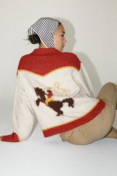 Our wilder sweater is a red and white zip up knit sweater that features a rodeo cowboy picture on back of sweater. 76% polyester 10% nylon 10% acrylic 4% wool Cowboy Sweater, Zip Up Knit Sweater, Cowgirl Life, Cowboy Pictures, Western Style Outfits, Rodeo Cowboy, Fall And Winter Fashion, Zip Cardigan, Farm Stand