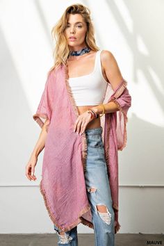 Experience the ease and elegance of our fringe trim kimono. Crafted from a light-weight, soft fabric, this versatile cover-up is perfect for any event. Perfectly suited for dressy occasions and both day and night events, the kimono offers a flattering, loose fit that can be dressed up or down, worn over shorts, jeans, or a beautiful dress. Enjoy the fun and beauty of the fringe trim for an effortless look. Chic Spring Unlined Cover-up, Chic Unlined Spring Cover-up, Chic Spring Layering Cover-up, Open Front Beach Kimono With Tassels, Long Tasseled Kimono For Beach Cover-up, Spring Loungewear Tunic Kimono, Spring Tunic Kimono For Loungewear, Open Front Kimono With Tassels For Beach, Long Fringed Kimono For Beach