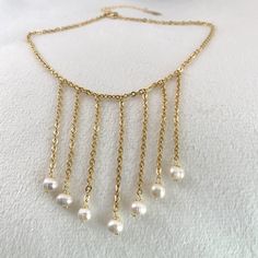 Waterfall necklace, Modern pearl necklace, classic pearl necklace, freshwater white pearl necklace, bridesmaid gift ideas, stylish necklace. Jewelry is one of the ways people identify themselves to others. For this reason consider to wear this stylish Cascade necklace as a way to expresses your captivating personality. Perfect to wear on your special day! For sure this delicate necklace will enhance your natural beauty! 💕 ITEM DESCRIPTION: Total length: 15 inches. The length of the necklace ref Elegant Dangle Pearl Necklace For Parties, Elegant Pearl Dangle Necklace For Party, Elegant Pearl Pendant Necklace For Parties, Elegant Dangle Pearl Necklace With Pendant, Elegant Pearl Necklace With Dangle Pendant, White Pearl Dangle Necklace With Clavicle Chain, Formal Dangle Pearl Drop Necklace, White Pearl Necklace With Clavicle Chain And Dangle, Dangle Pearl Drop Necklace For Party