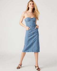 This denim dress combines the casual appeal of blue denim with the sophistication of a bustier top and pencil skirt. Perfect for a cocktail event or dinner out, the midi length offers just the right amount of coverage while still showing off your curves. Bustier denim midi dress Pencil skirt bottom Back zipper closure Length: 35.75" 98% cotton 2% spandex Hand wash Emma is 5ft 10in and is wearing a size small Imported Elegant Denim Dress For Date Night, Elegant Fitted Denim Dress For Date Night, Elegant Spring Denim Dress For Date Night, Chic Strapless Fitted Denim Dress, Fitted Knee-length Denim Party Dress, Chic Fitted Strapless Denim Dress, Fitted Knee-length Denim Dress For Party, Elegant Denim Dress For Spring Night Out, Elegant Spring Denim Dress For Night Out