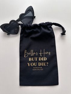 a black bag with sunglasses on top of it