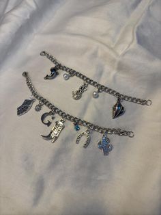 ♡ welcome to the custom charm bracelet shop! ♡ as our business grows, we will be adding more charms and chains, so keep an eye out for new styles! how it works: 1. pick a chain length 2. pick how many charms you would like (maximum of 10; want more than 10? message me!) 3. choose your charms and charm layout 4. in the personalization section, let us know which charms you've picked and how you would like them laid out from left to right. if you don't specify a layout, we'll make sure to make it l Custom Charm Bracelet, Charm Bracelet Silver, Diy Charm, Bracelet Shop, Diy Charm Bracelet, New Charmed, Custom Charms, Silver Chain Bracelet, Silver Charm Bracelet