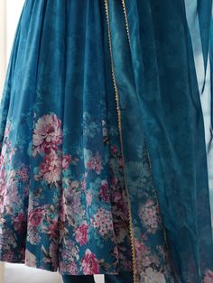 This beautiful blue color organza anarkali suit features intricate floral print work, making it a perfect choice for festivals, functions, and events. The set includes a matching cotton silk pant and a dupatta with floral print work and border gota patti lace work.
The anarkali suit has a 2.3-meter flair, and the dupatta is also 2.3-meters long.  This blue anarkali pantsuit include its fully stitched design, available in sizes XS to XXL, ensuring a perfect fit for everyone.
The vibrant blue Blue Anarkali Set In Organza, Blue Organza Anarkali Set For Festive Occasions, Blue Organza Anarkali Set For Eid, Blue Anarkali Set With Sheer Dupatta For Festivals, Festive Blue Organza Anarkali Set, Bollywood Style Lehenga With Digital Print For Eid, Blue Unstitched Anarkali Set For Festivals, Blue Lehenga With Printed Motifs For Eid, Festive Blue Salwar Kameez With Printed Border