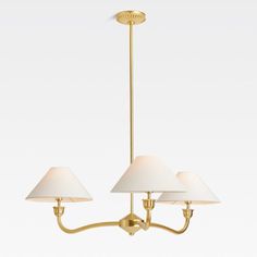 three light brass chandelier with white shades