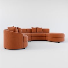 an orange sectional couch with pillows on it's back and side, in front of a white background