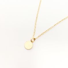 Elena Disc Charm Necklaces | Gold - MTT Collective Minimalist 14k Gold Hand Stamped Charm Necklace, Minimalist Gold Charm Necklaces, Gold Circular Charm Necklace With Adjustable Chain, Everyday Yellow Gold Circle Charm Necklace, Minimalist Yellow Gold Hand Stamped Charm Necklace, Minimalist 14k Gold Filled Charm Necklace As Personalized Gift, Minimalist Medallion Coin Necklace, Minimalist Coin Necklace With Adjustable Chain, Minimalist Tarnish-resistant Coin Necklace