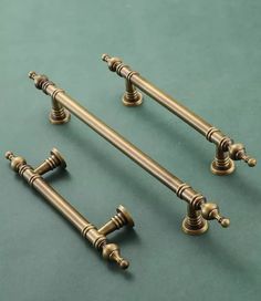 three antique style brass plated curtain rods