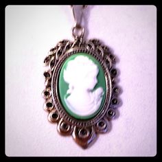 This Is A Gorgeous Handmade Superbly Detailed Cameo! From Her Hair, To The Roses On Her Dress, To Her Dainty Detailed Pearl Necklace! This Beautiful Green Cameo Is 1 1/8h X 3/4"W And Is Suspended From An 18" 925 Sterling Silver Chain With A Lobster Claw Clasp. Excellent Gift For Yourself Or Your Loved Ones! Comes Already Gift Wrapped And In A Fancy Gold Gift Box! Comes From A Smoke And Pet Free Environment. Please Ask Any Questions You Have. Offers Welcome! Bundle Items From My Closet And Save! Classic Cameo Necklace For Gift, Classic Cameo Necklace As Gift, Silver Cameo Round Pendant Jewelry, Silver Cameo Jewelry With Round Pendant, Classic Antique Silver Nickel-free Necklace, Nickel-free Oval Pendant Necklace For Formal Occasions, Round Silver Cameo Necklace, Formal Nickel-free Necklace With Oval Pendant, Formal Nickel-free Oval Pendant Necklace