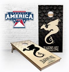 the cornhole game board has an image of a dragon on it and is ready to play