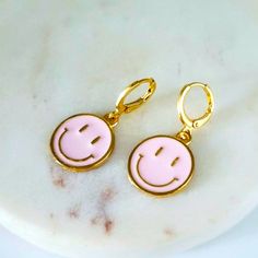 Pink Round Smiley Face Earrings. Huggies Earrings, Material Zinc Alloy And Enamel. 1.25 Length .4 Width Pink Fun Hoop Earrings, Fun Pink Hoop Earrings, Playful Pink Round Earrings, Pink Fun Dangle Jewelry, Fun Pink Dangle Jewelry, Pink Nickel-free Dainty Hoop Earrings, Pink Fun Hoop Earrings As Gift, Fun Pink Hoop Earrings As Gift, Pink Dainty Nickel-free Hoop Earrings