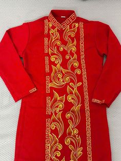 High-quality Vietnamese Dress for Men. It is very well-made with high-quality fabric with embroidered patterns. Some information about the product Ao Dai Vietnam: Material: Tuyet mua ( a popular fabric for making ao dai) Style: Traditional Pattern: Gold hoa van Length Ao Dai:  Approximately 42 Inches  NOTE: The dimensions listed in the size chart will be used to create the ao dai. Please select your size based on the table, and if you're having trouble finding your size, don't hesitate to write me; I'll be pleased to assist you.   There might be some chalk/ pen writings on the fabric because it is brand new, unwashed ao dai. These marks can be washed away easily. POLICY:  + I don't accept cancellations, returns, or exchanges. + In some circumstances, I can exchange it for a fee and buyers Traditional Fitted Cotton Ao Dai, Traditional Embroidered Ao Dai For Formal Occasions, Long Sleeve Kurta With Gold Embroidery For Traditional Ceremonies, Gold Embroidered Fitted Kurta For Traditional Ceremonies, Fitted Long Sleeve Kurta With Gold Embroidery, Ceremonial Embroidered Ao Dai With Long Sleeves, Men Ao Dai, Ao Dai Men, Ao Dai Vietnamese